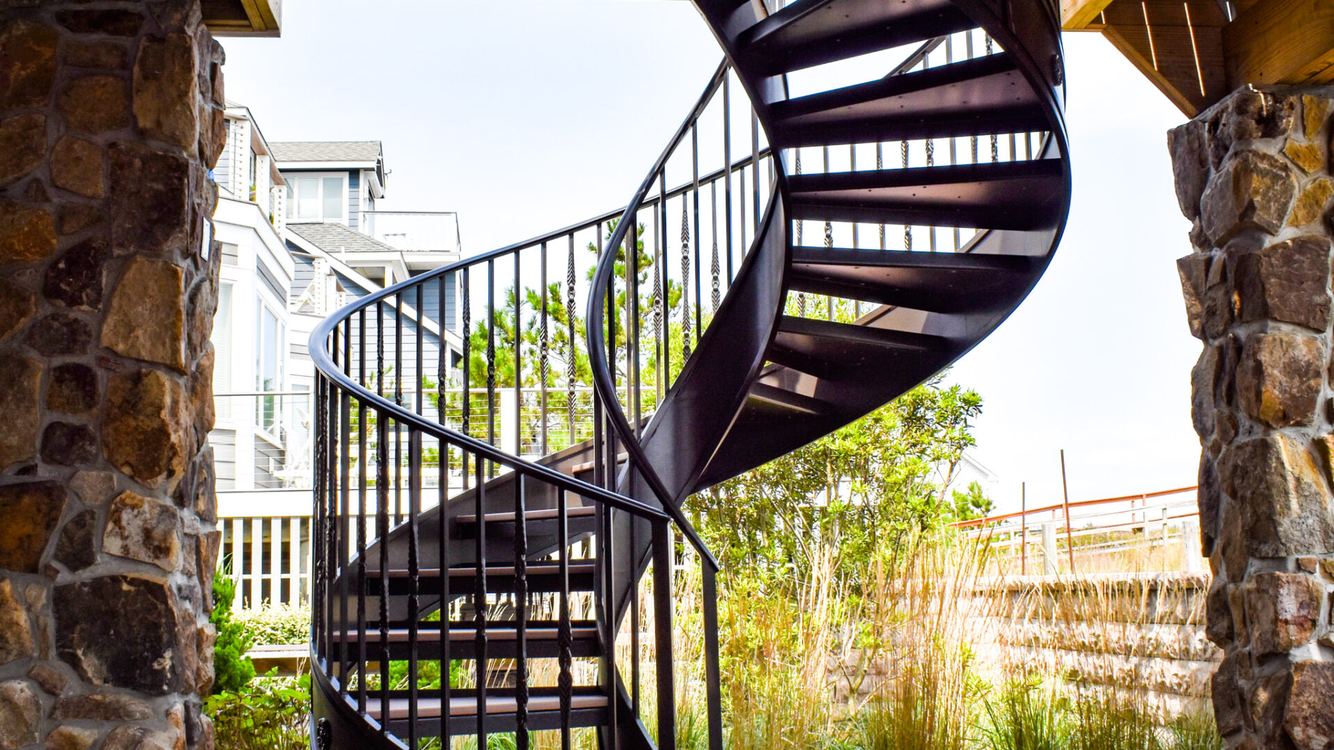 Helical shore staircase blending natural surroundings with modern design