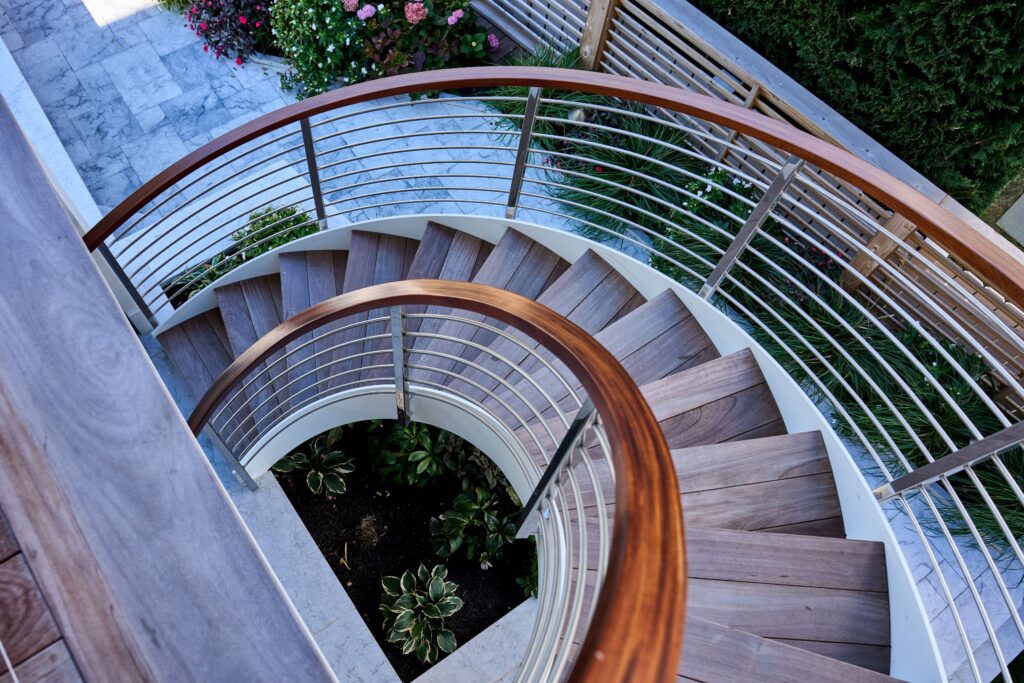 Custom Helical Staircase with Wood Caprail