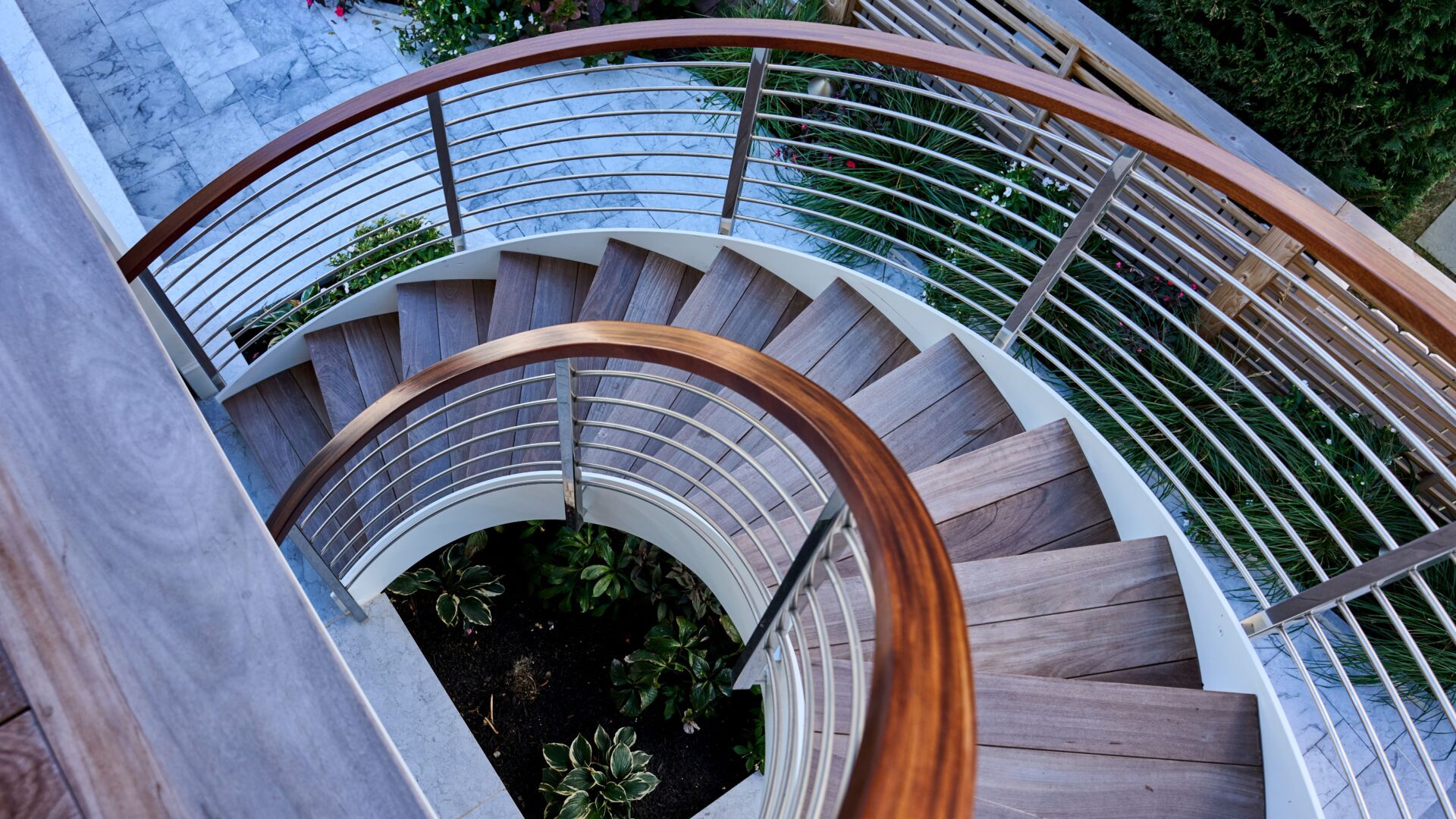Custom Helical Staircase with Wood Caprail