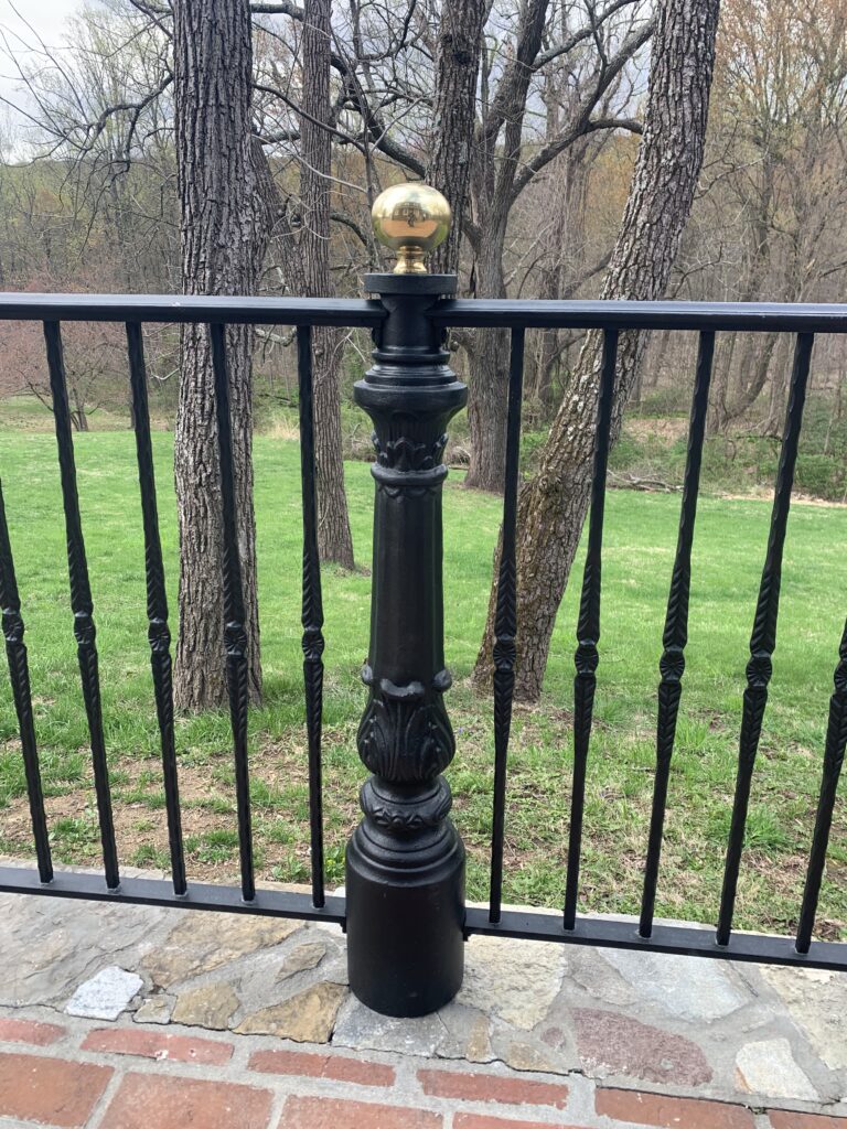 Wrought iron post and bronze ball cap
