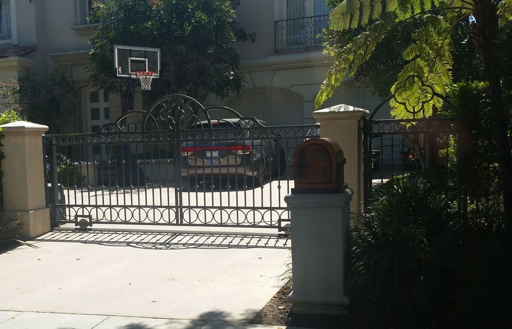 Iron Driveway Gate Secures this Property
