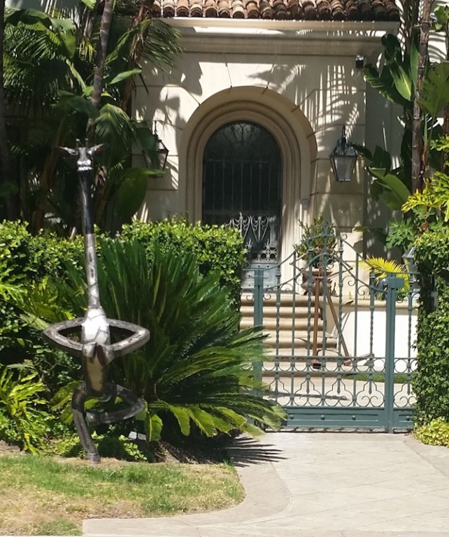 Iron Gate and Metal Giraffe Sculpture